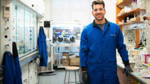A man, Frank Leibfarth, poses for a photo in a laboratory